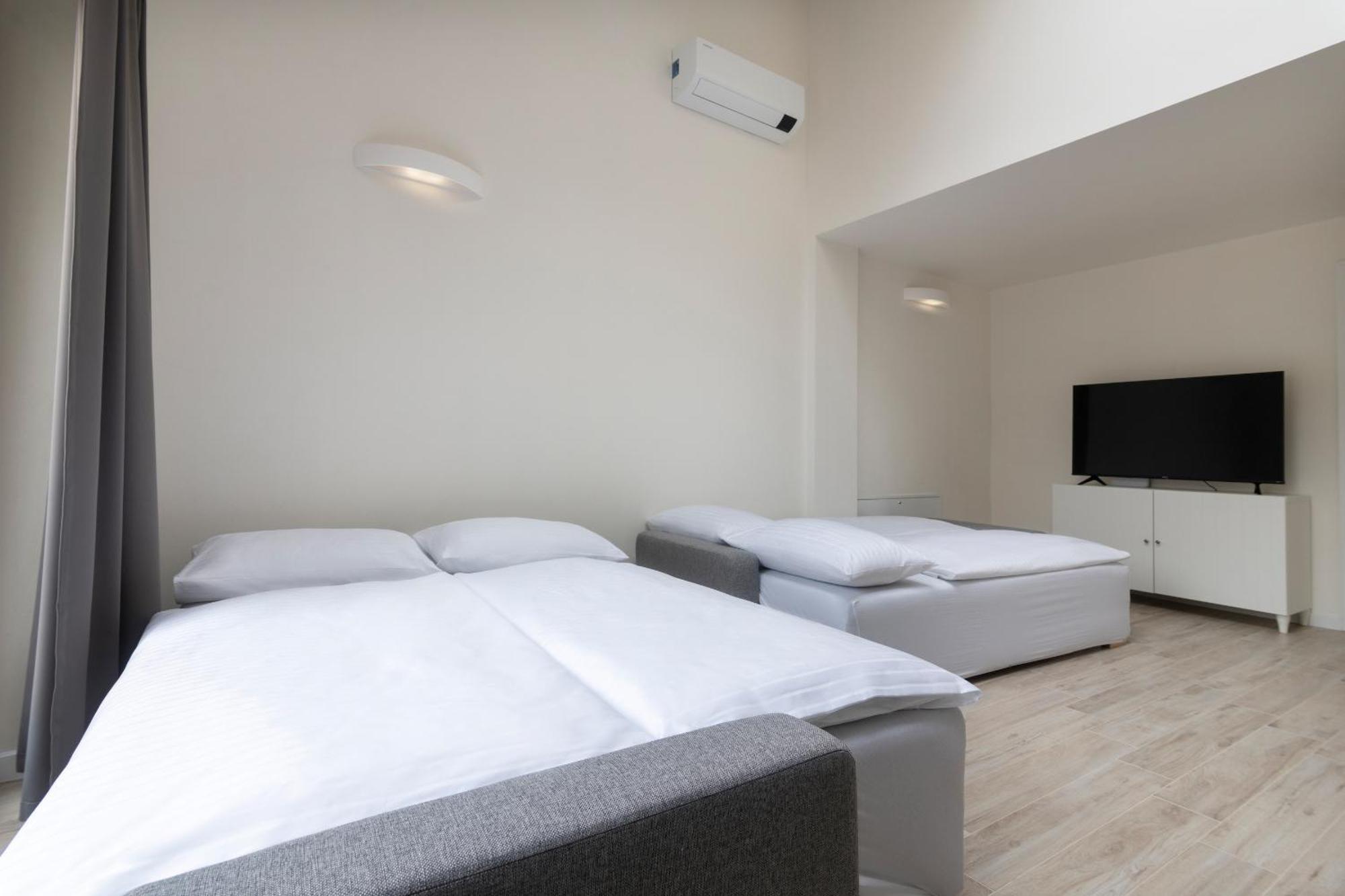 Kinsky Garden Apartments And Suites By Dwellfort Praga Quarto foto